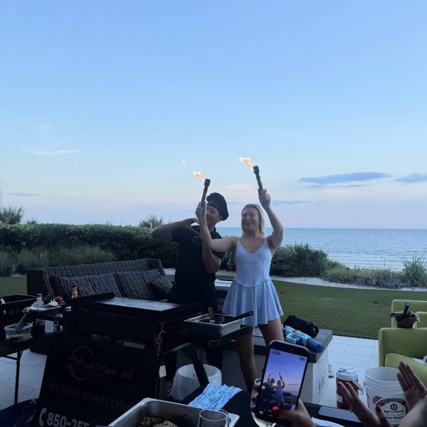 Hibachi chef performing a fire show at a beachside private party in Madeira Beach, Florida